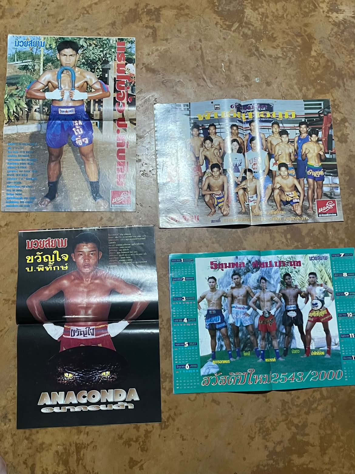 Muay Siam posters and a 2000 New Year calendar from the collection